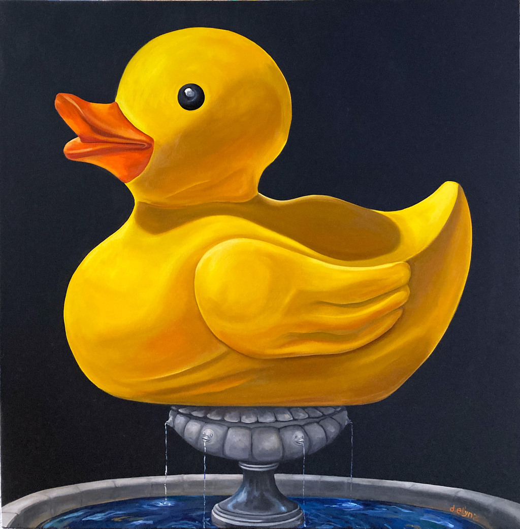 large yellow rubber duck on top of fountain with ducks spitting water